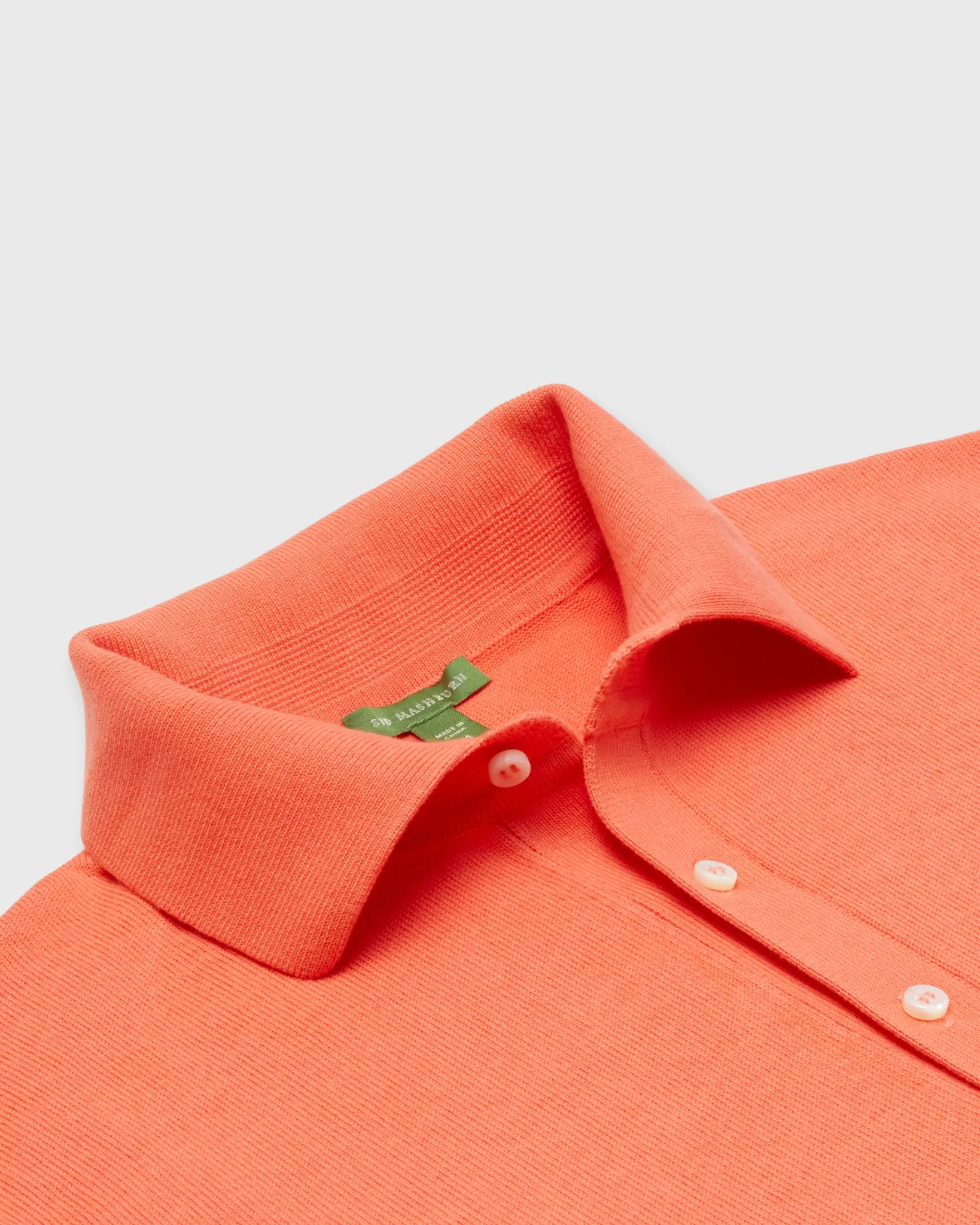 Rally Polo Sweater in Papaya Cotton